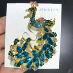PENDRA Sparkling Peacock Brooch