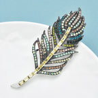 PENDRA Feathera Rhinestone Feather Brooch