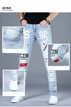 2025 Summer Ripped Jeans Men's Slim-fitting Small Feet Elastic Trousers Trendy Brand Fashion Scratched Patch Cargo Beggar Pants
