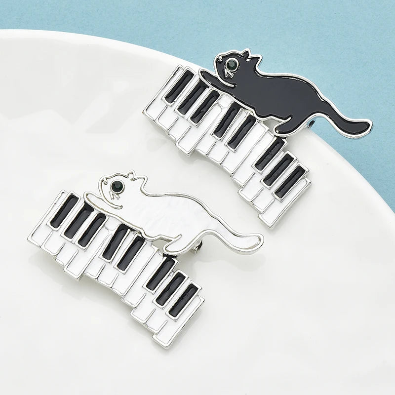 Wuli&baby Enamel Naughty Cat Brooch Pins 2-color Cat Running On Piano For Women Kid's Clothes Backpack Brooches Gifts